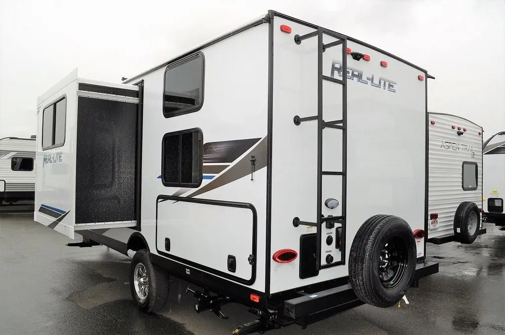 Side view of the New 2022 Palomino Real-Lite Mini RL189 Travel Trailer RV.