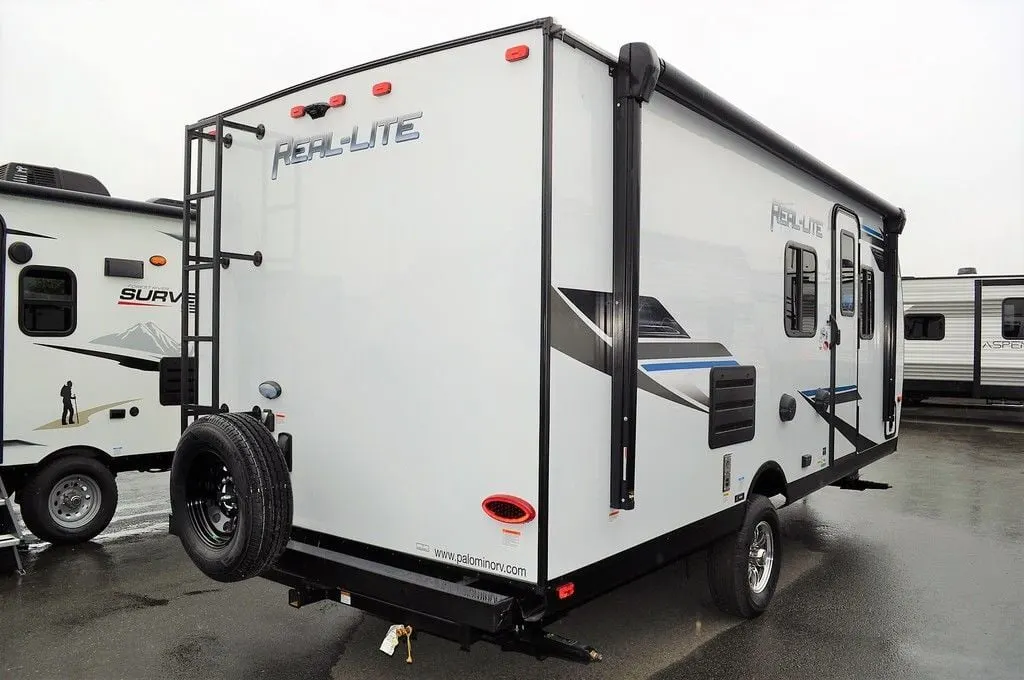 Side view of the New 2022 Palomino Real-Lite Mini RL189 Travel Trailer RV.