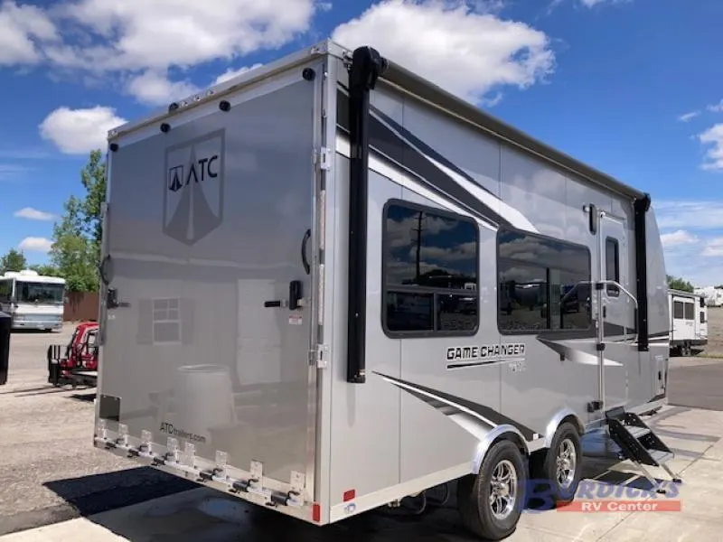 Side view of the New 2022 ATC TRAILERS Game Changer 2015 Travel Trailer Toy Hauler RV.