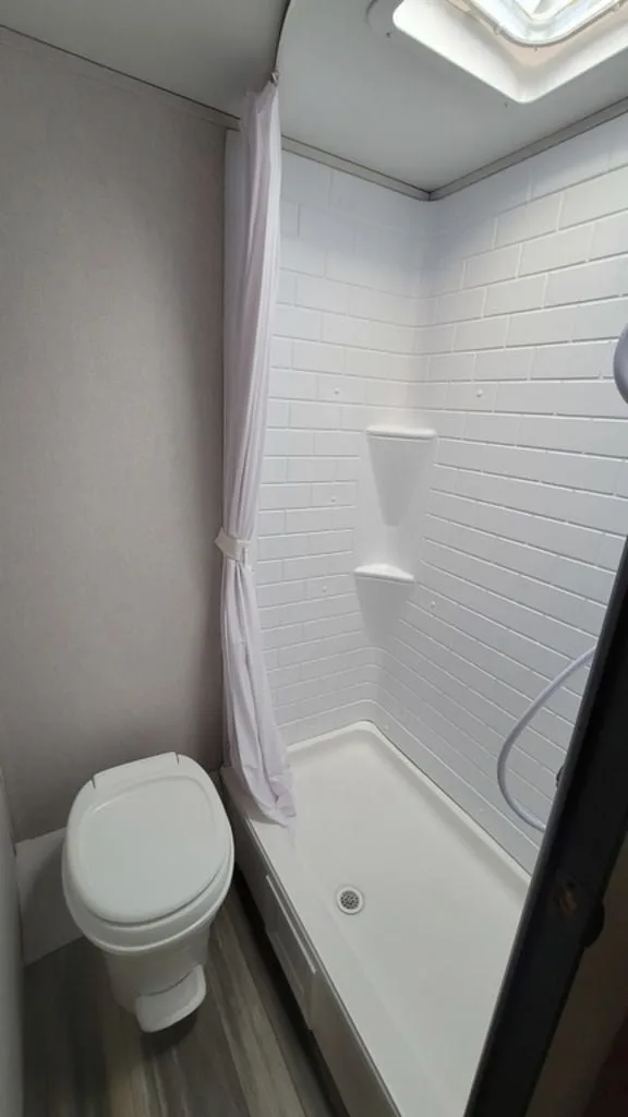 Bathroom with a toilet and a shower.