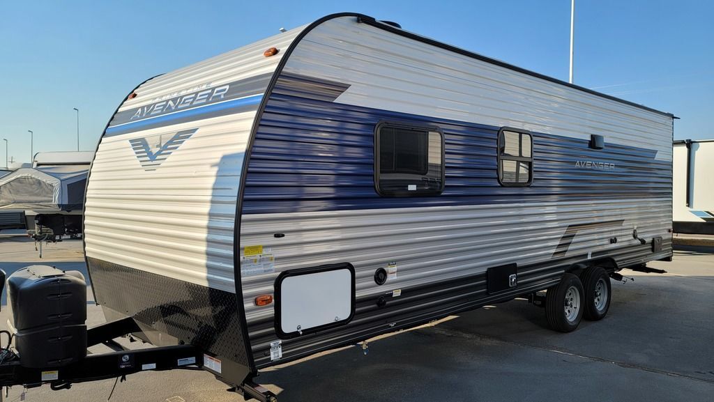 Side view of the New 2022 Prime Time Avenger 26BK Travel Trailer RV.