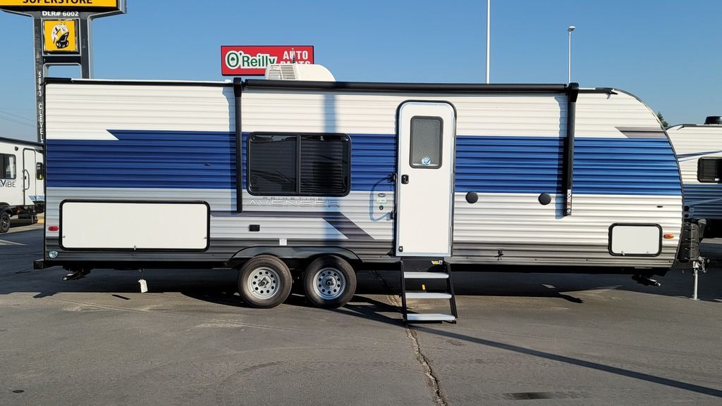 Side view of the New 2022 Prime Time Avenger 26BK Travel Trailer RV.