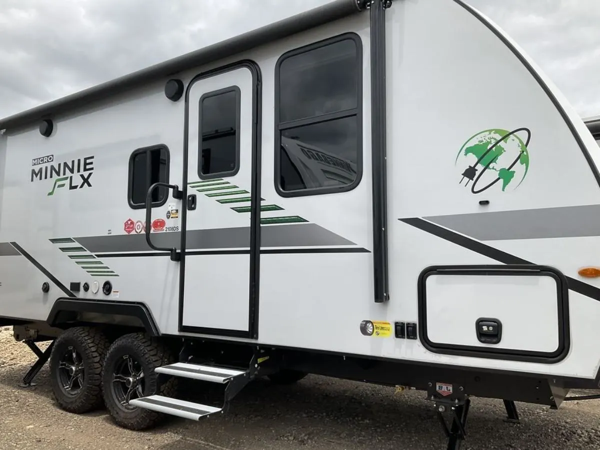 Side view of the New 2022 Winnebago Micro Minnie FLX 2100BH Travel Trailer RV.