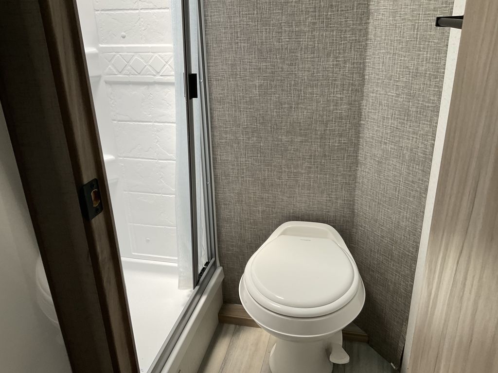 Bathroom with a toilet and a walk-in shower.