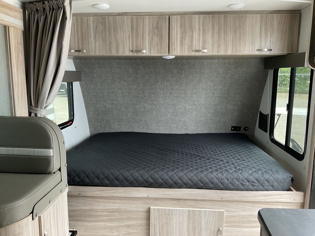 Bedroom with overhead cabinets.