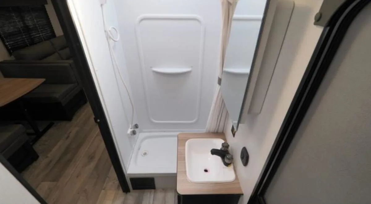 Bathroom with a sink and a walk-in shower.