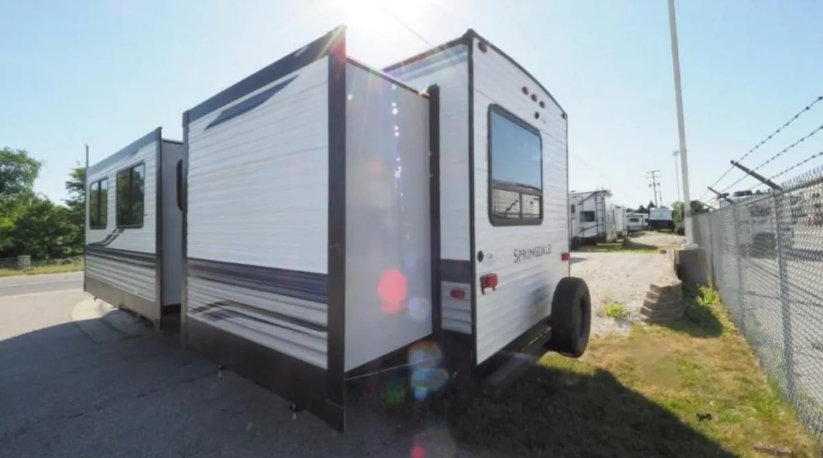 Side view of the RV with slide outs.