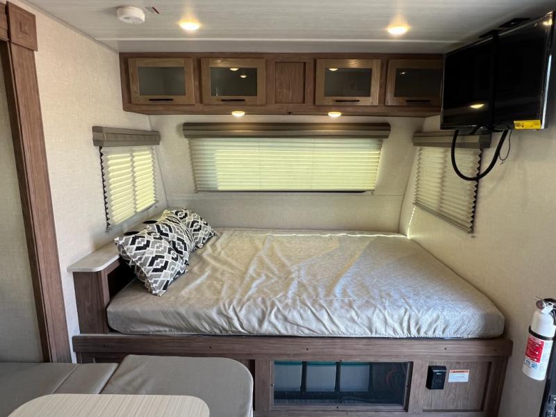 Bedroom with overhead cabinets.