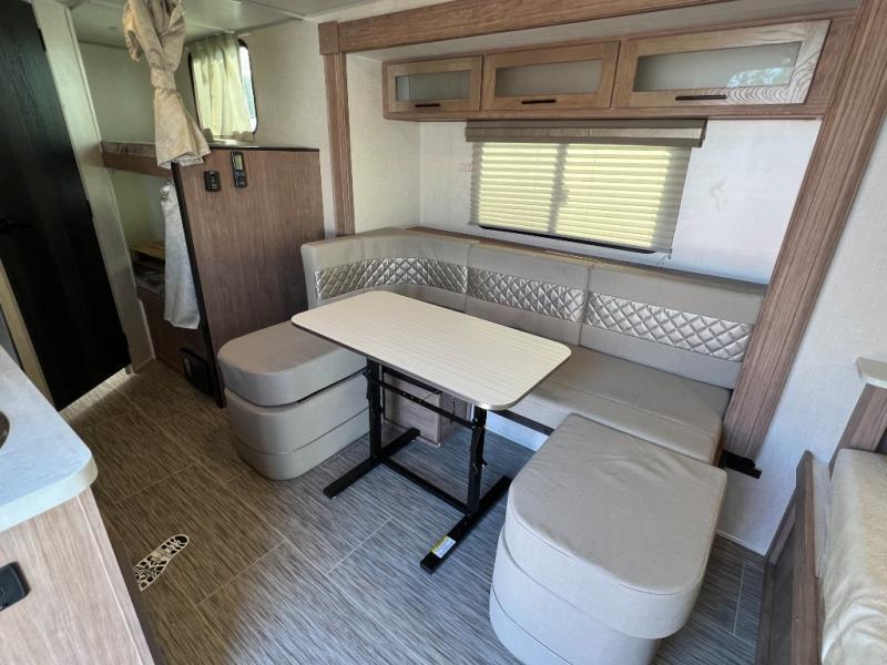 Dinette with overhead cabinets.