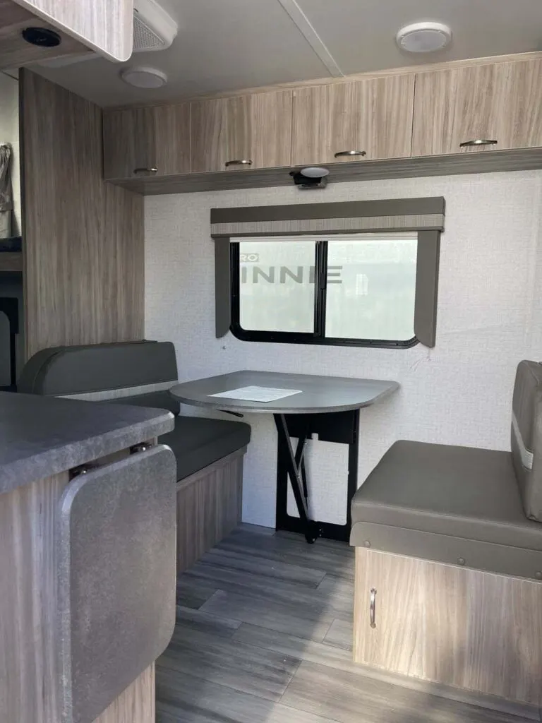 Dinette with overhead cabinets.