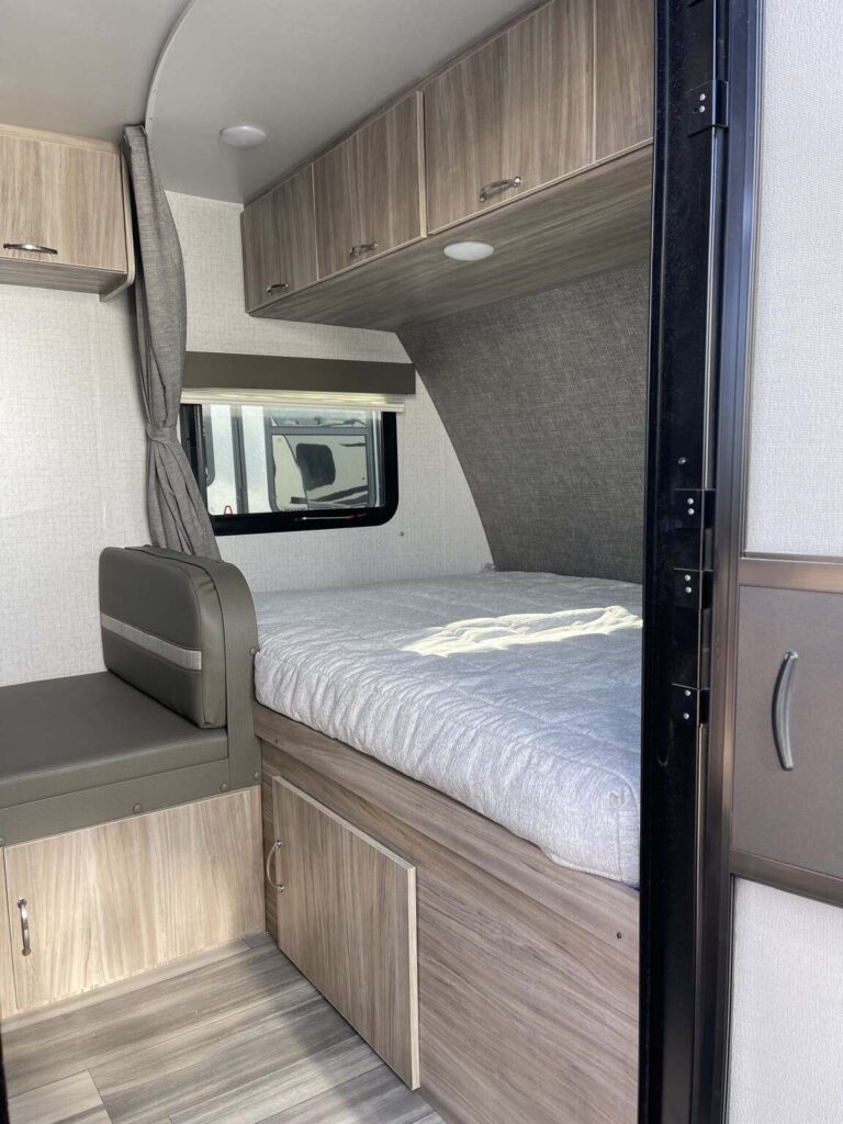 Bedroom with overhead cabinets.