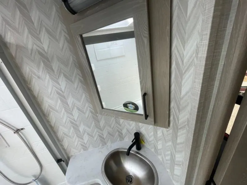 Bathroom with a sink and a medicine cabinet.