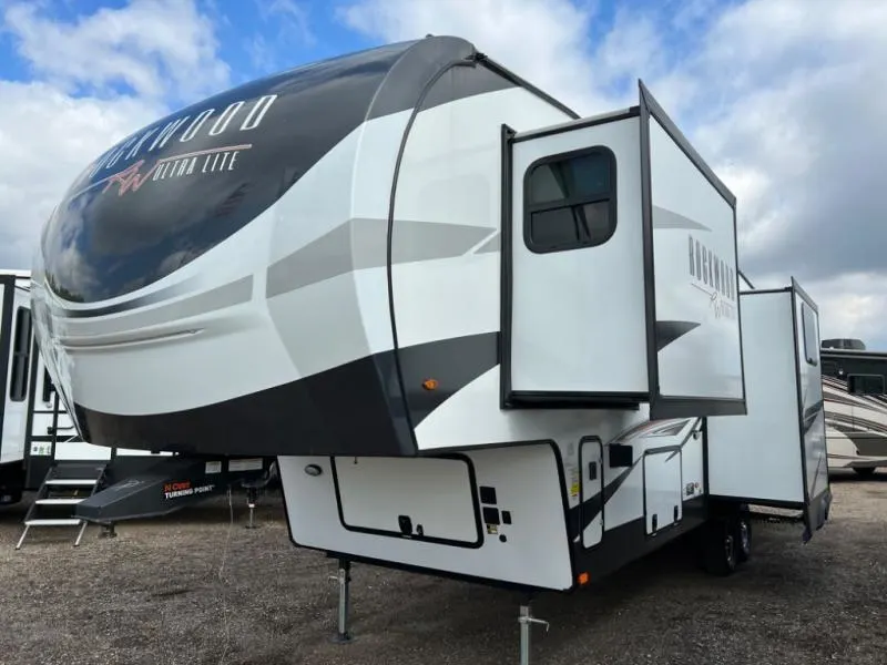 Side view of the RV with slide outs.