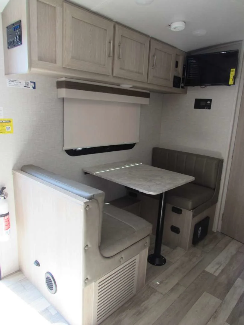 Dinette with overhead cabinets.