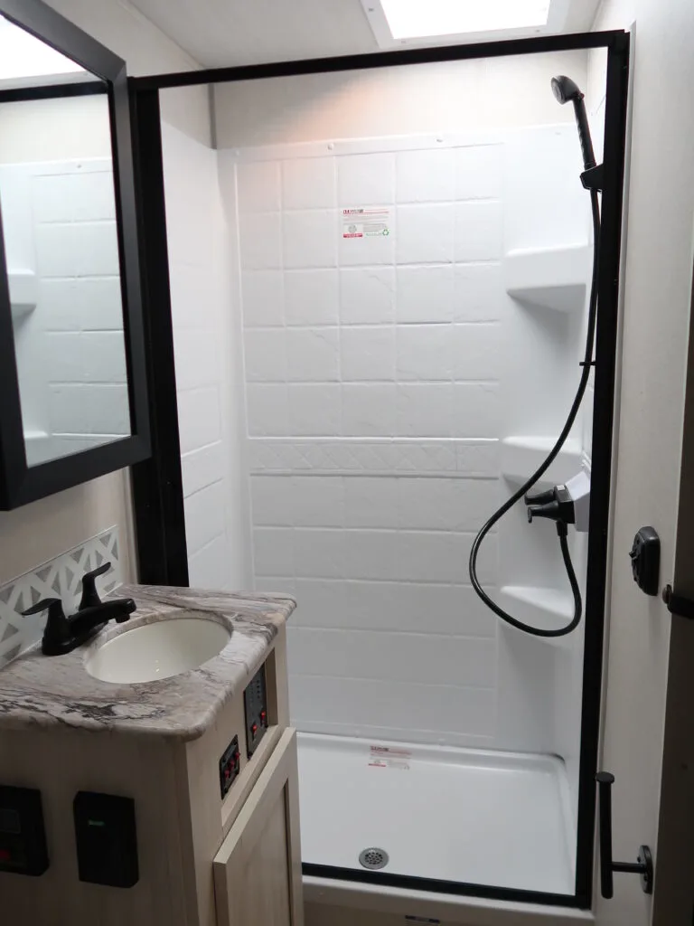 Bathroom with a sink and a walk-in shower.