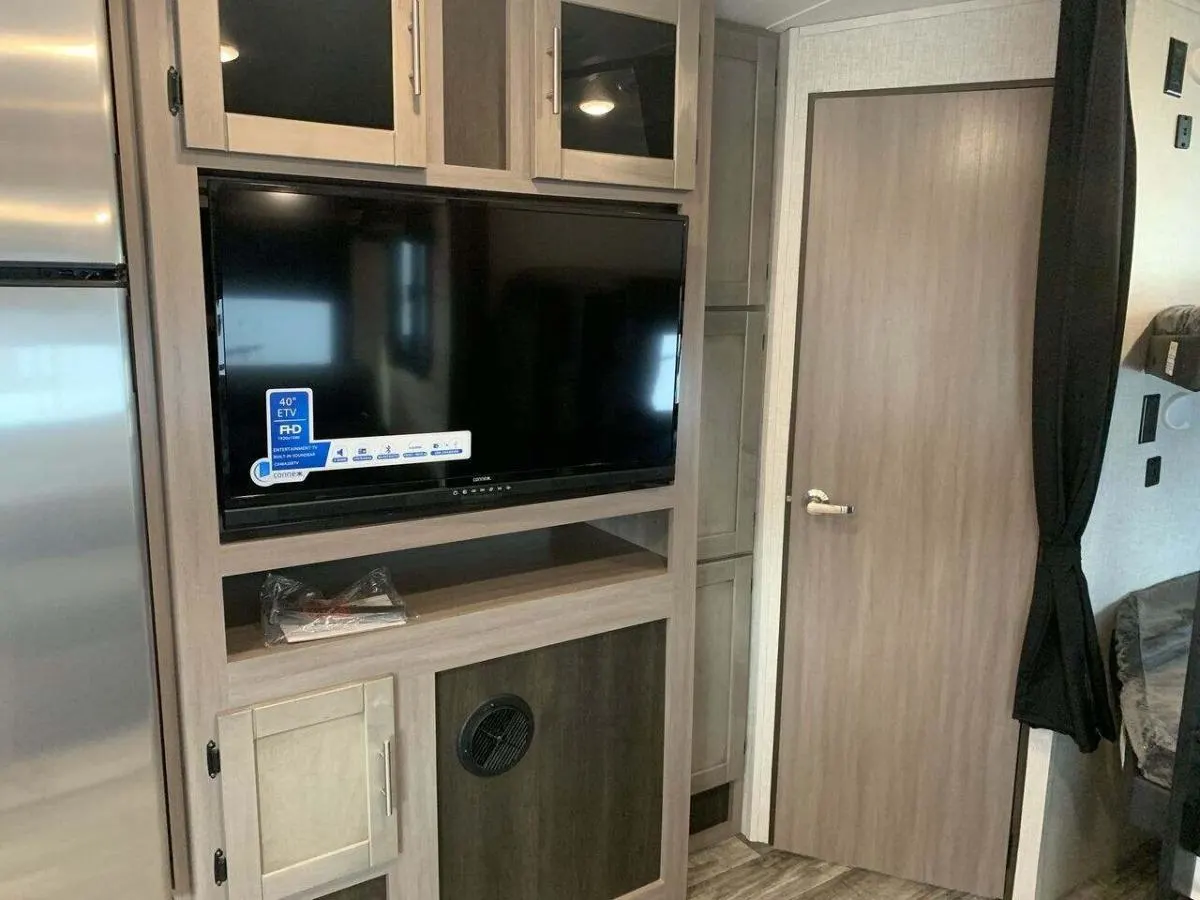 Entertainment center with a TV.