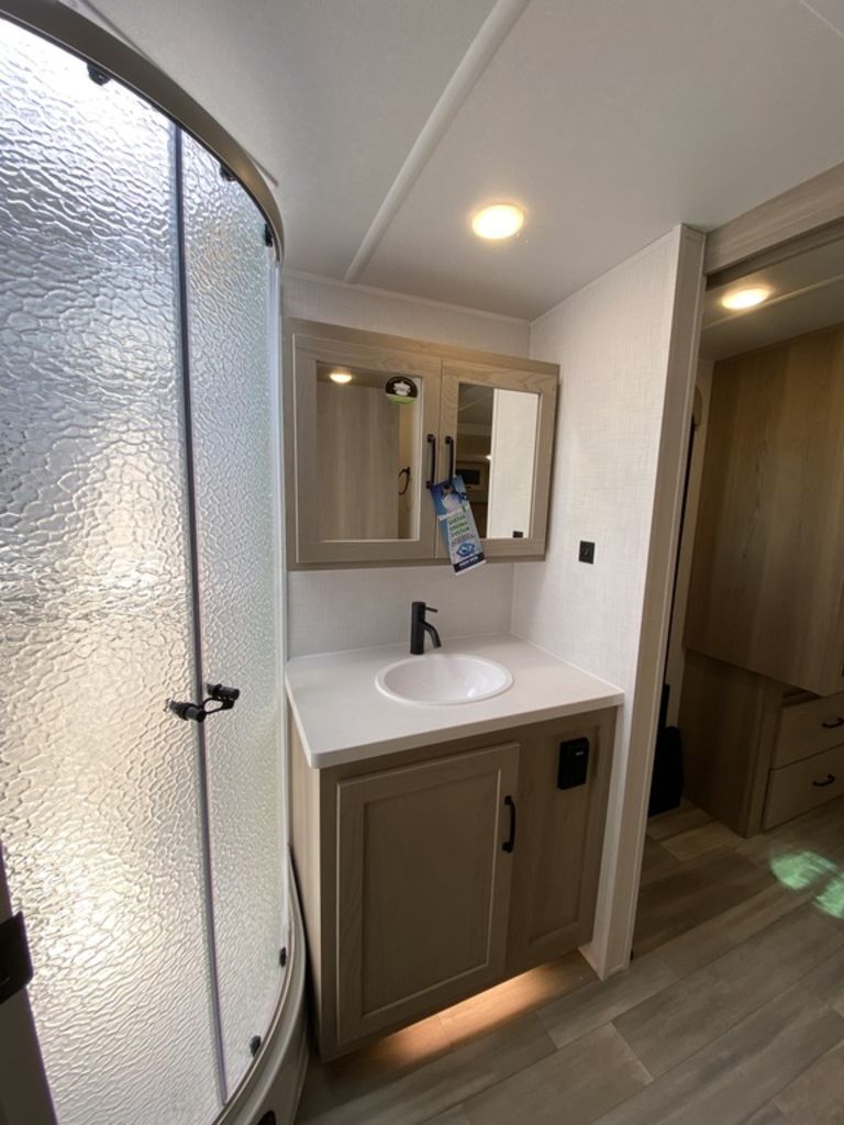 Bathroom with a sink and a walk-in shower.