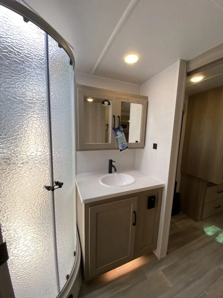 Bathroom with a sink and a walk-in shower.