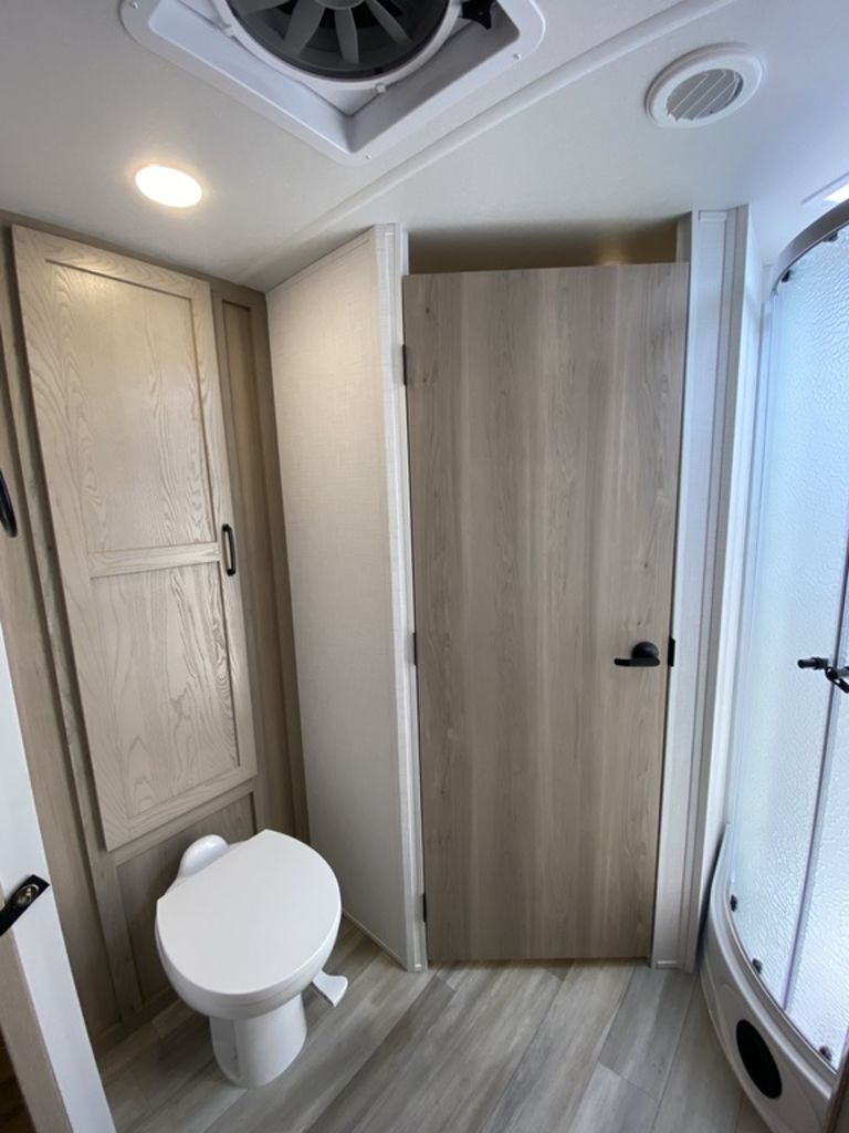 Bathroom with a toilet and a walk-in shower.