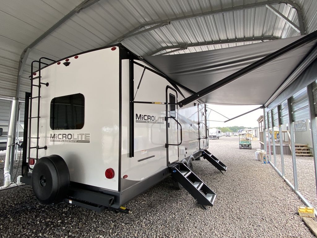 Side view of the New 2024 Forest River Flagstaff Micro Lite 25FKBS Travel Trailer RV.