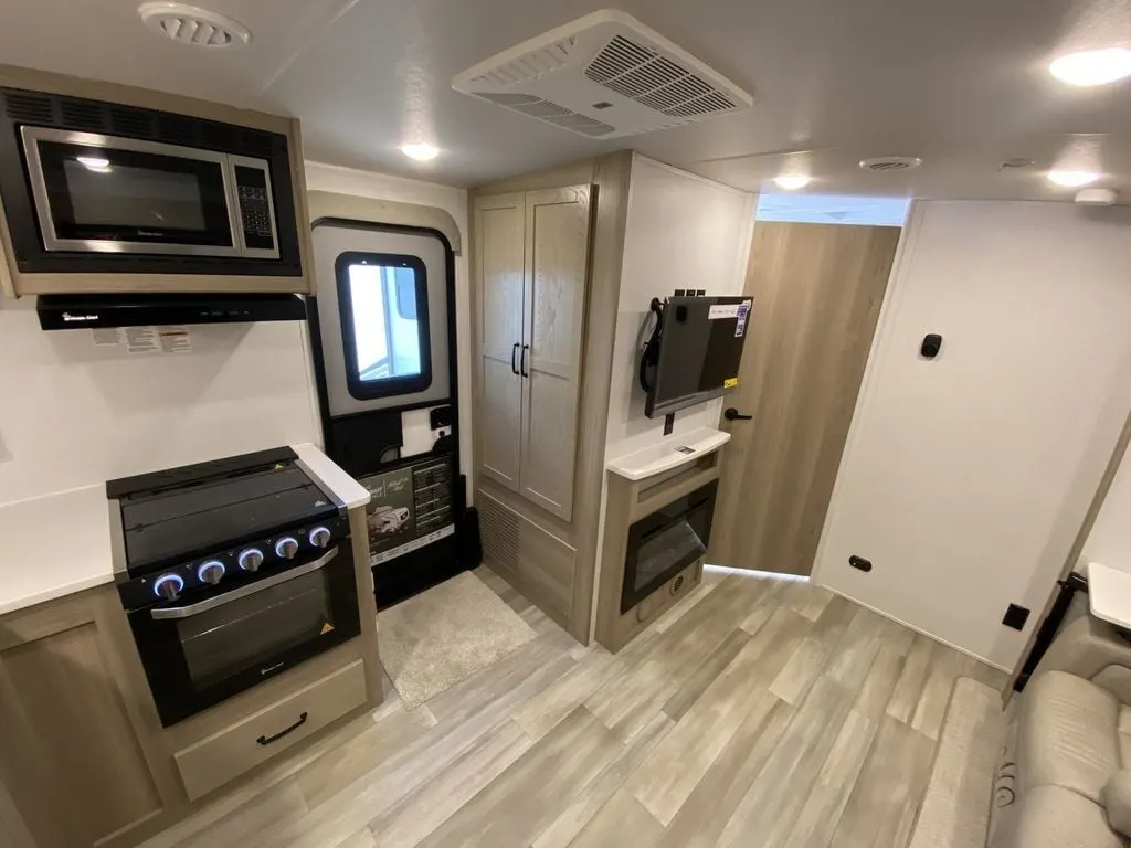 Kitchen with a gas range, oven, and cabinets.