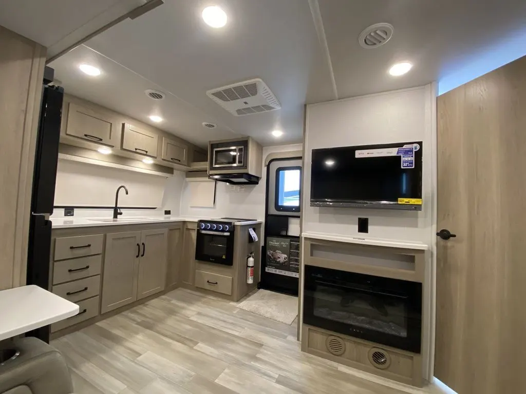 Kitchen with a gas range, oven, sink and cabinets.