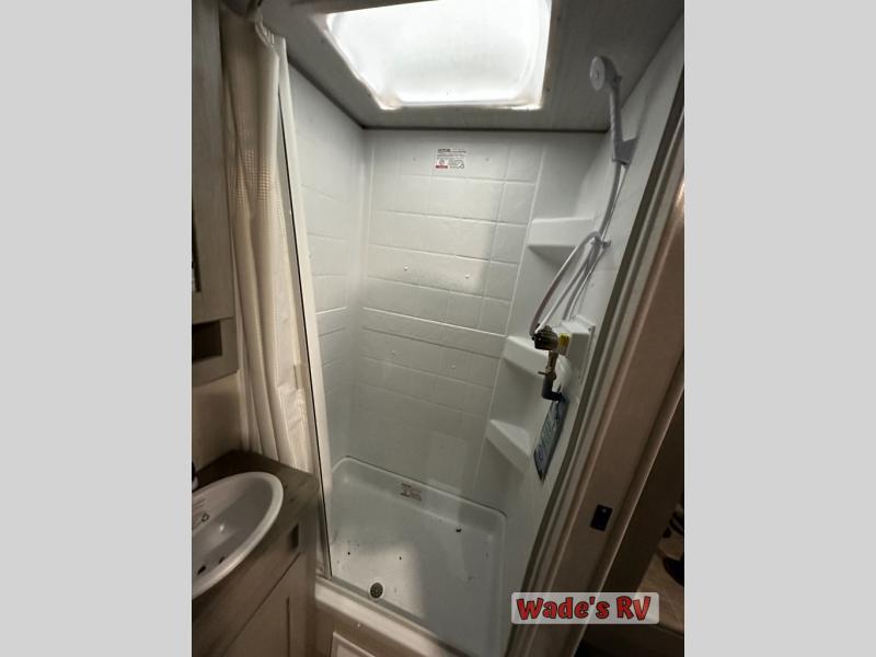 Bathroom with a sink and a walk-in shower.