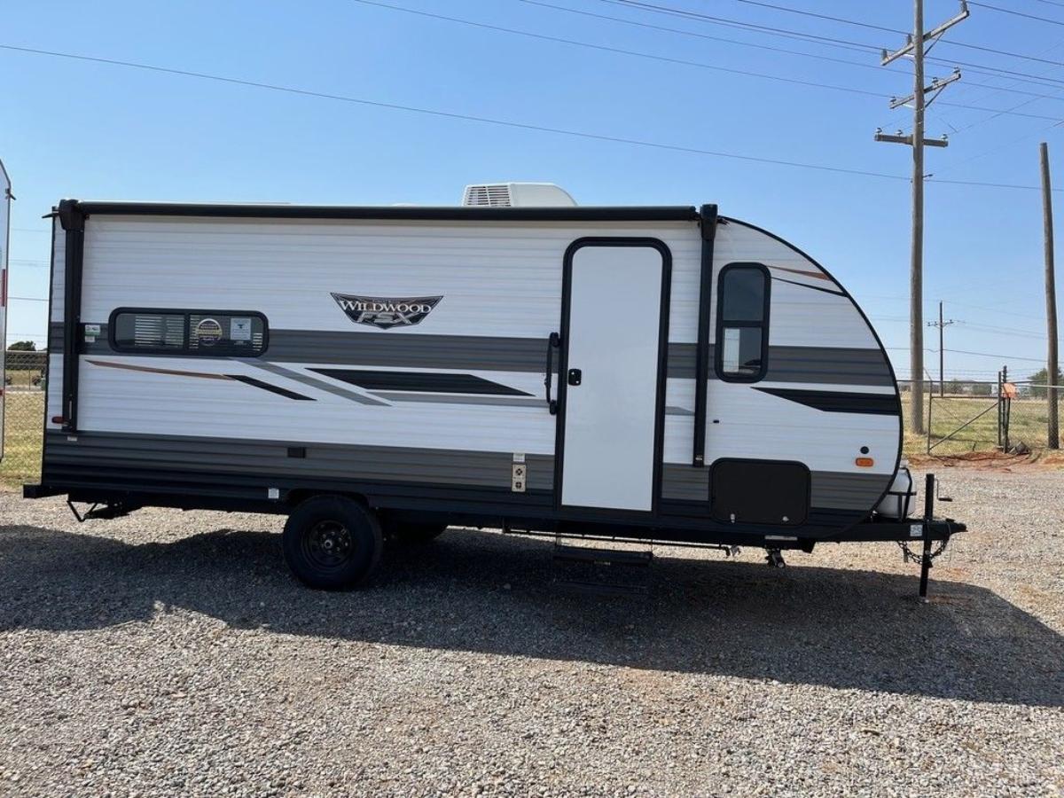 Side view of the New 2022 Forest River Wildwood FSX Northwest 169RSK Travel Trailer RV.