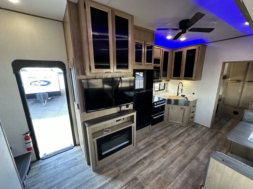 Kitchen with a gas range, fridge, oven, sink and cabinets.