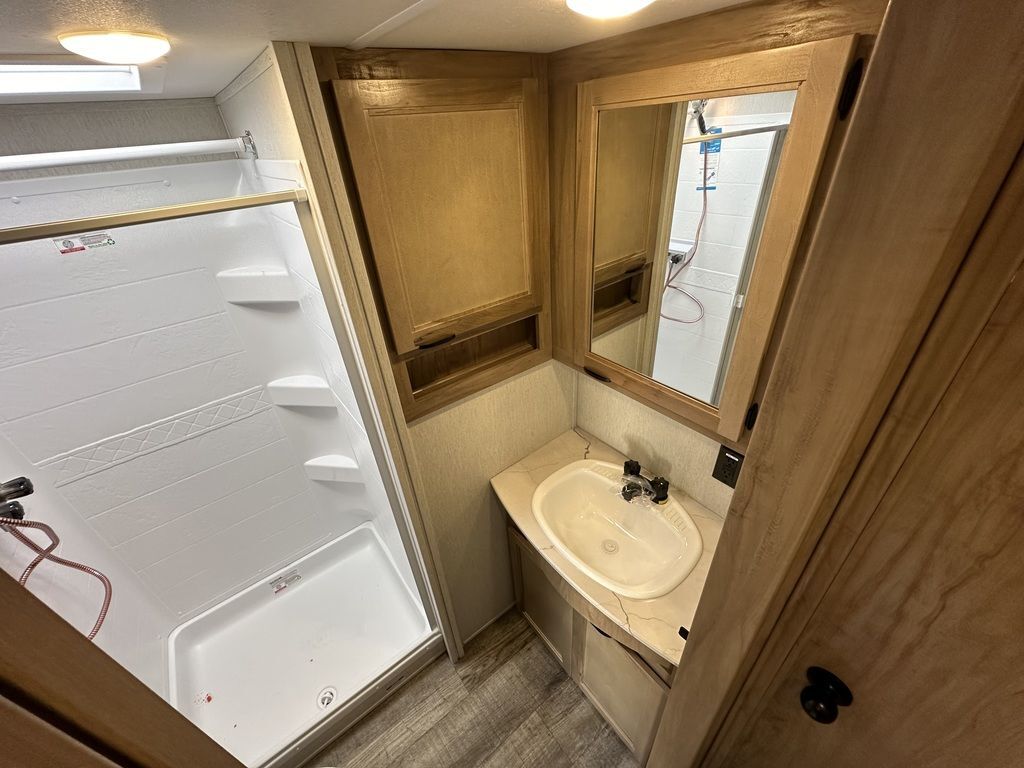 Bathroom with a sink and a walk-in shower.