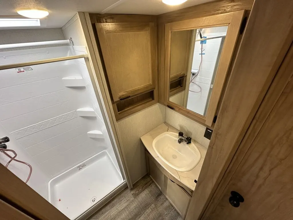 Bathroom with a sink and a walk-in shower.