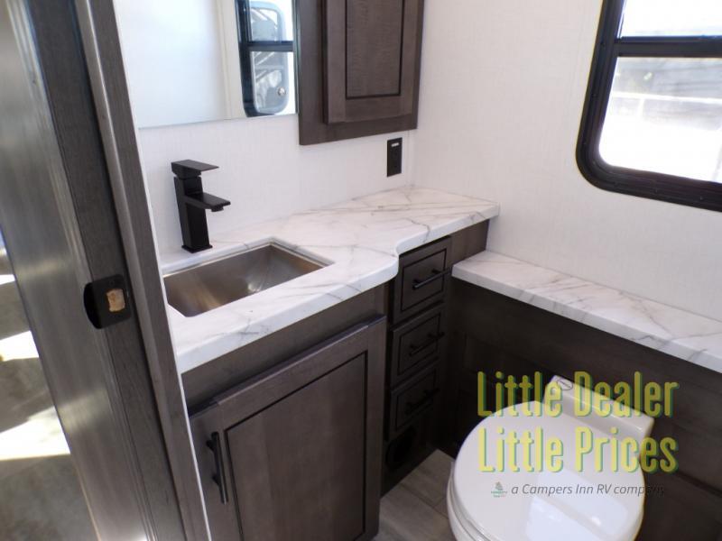 Bathroom with a sink, toilet and a medicine cabinet.