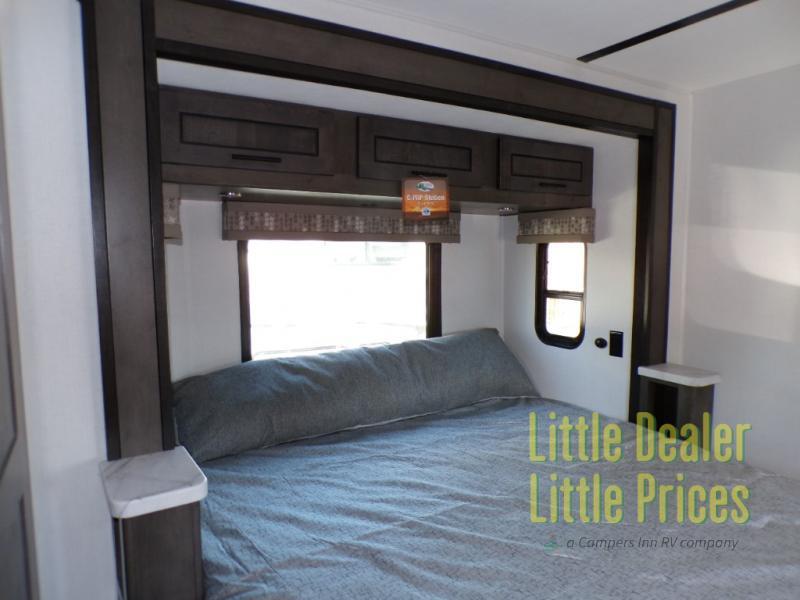 Bedroom with overhead cabinets.