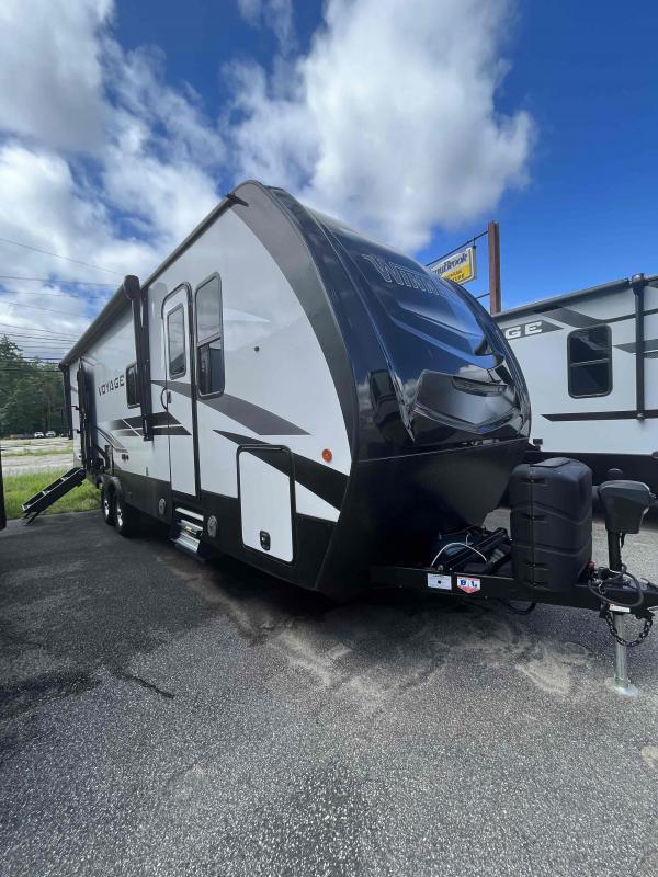 Side view of the New 2022 Winnebago Voyage V2831RB Voyage Travel Trailer RV.