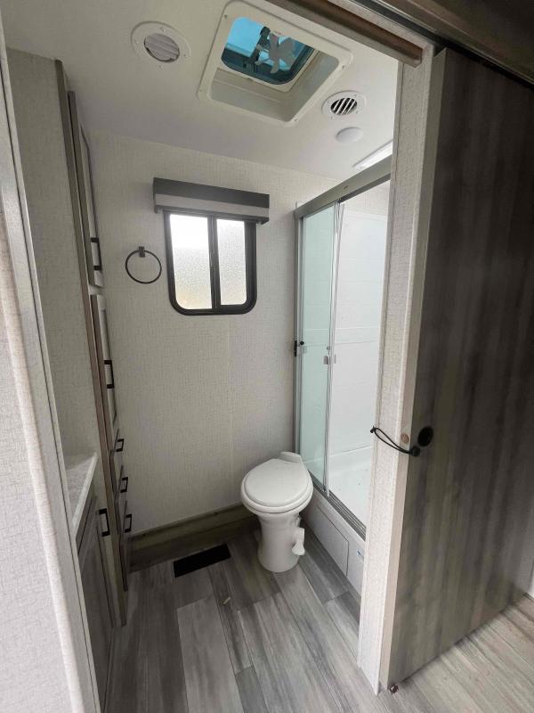 Bathroom with a toilet and a walk-in shower.