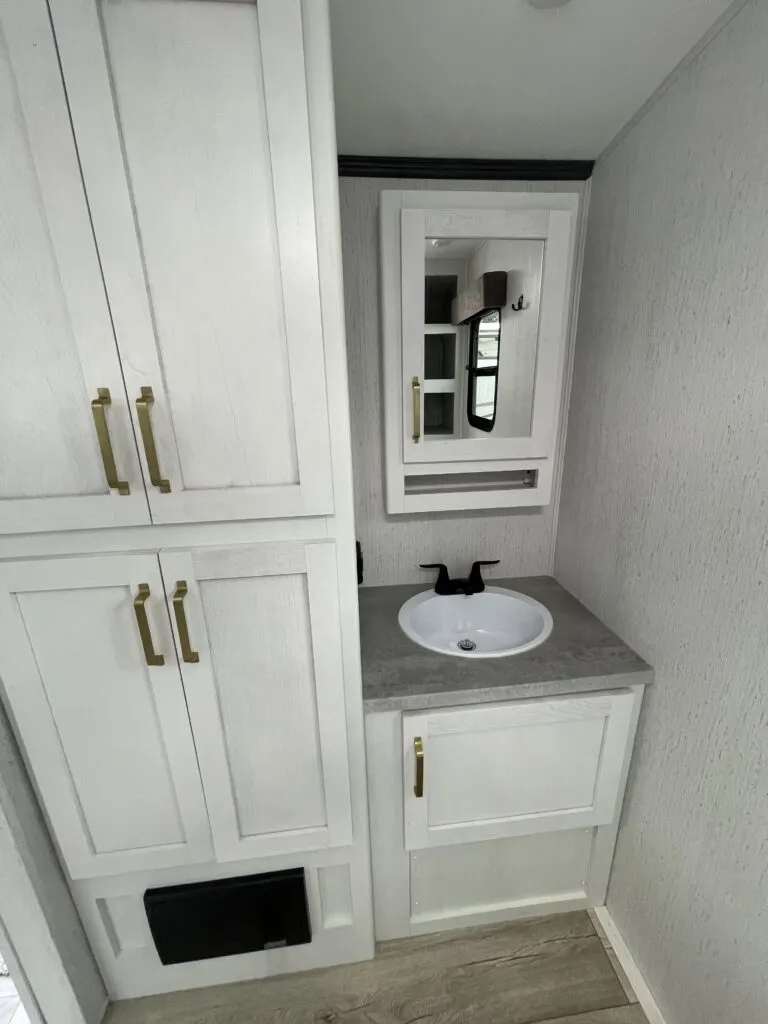 Bathroom with a sink, linen and a medicine cabinet.