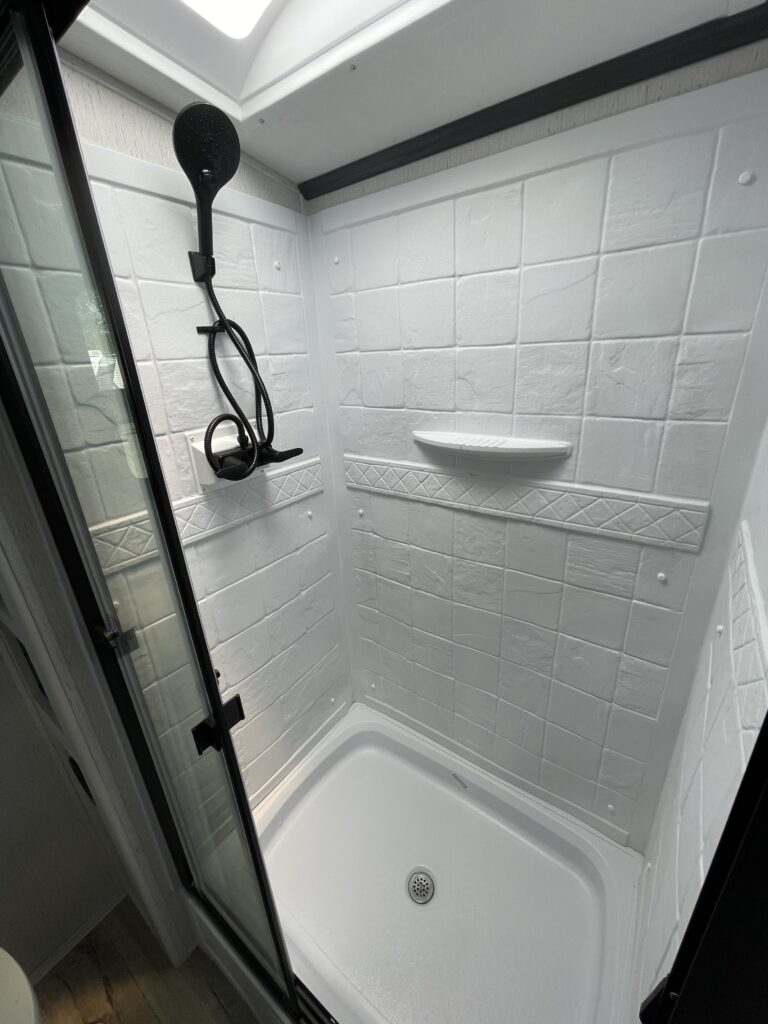 Bathroom with a walk-in shower.