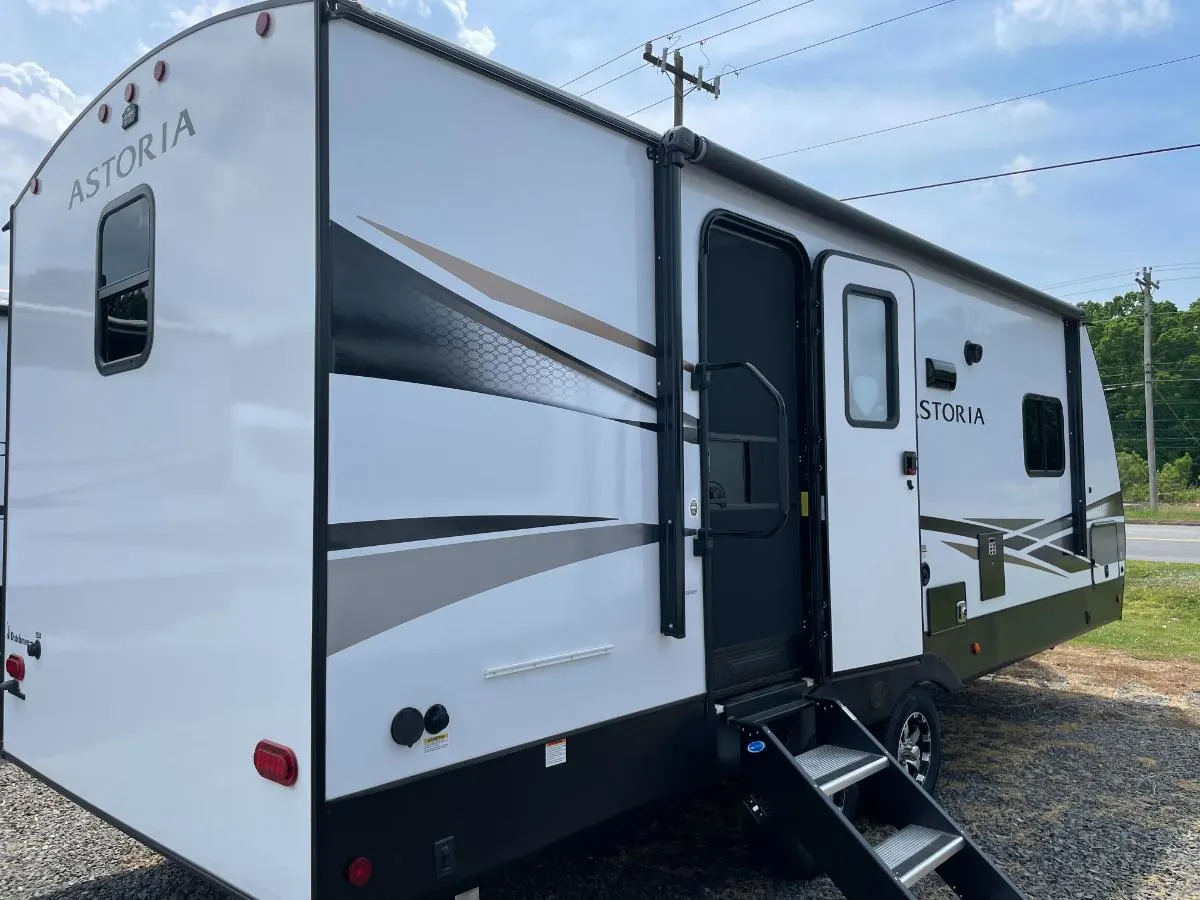 Side view of the New 2022 Dutchmen ASTORIA 2203RB Travel Trailer RV.