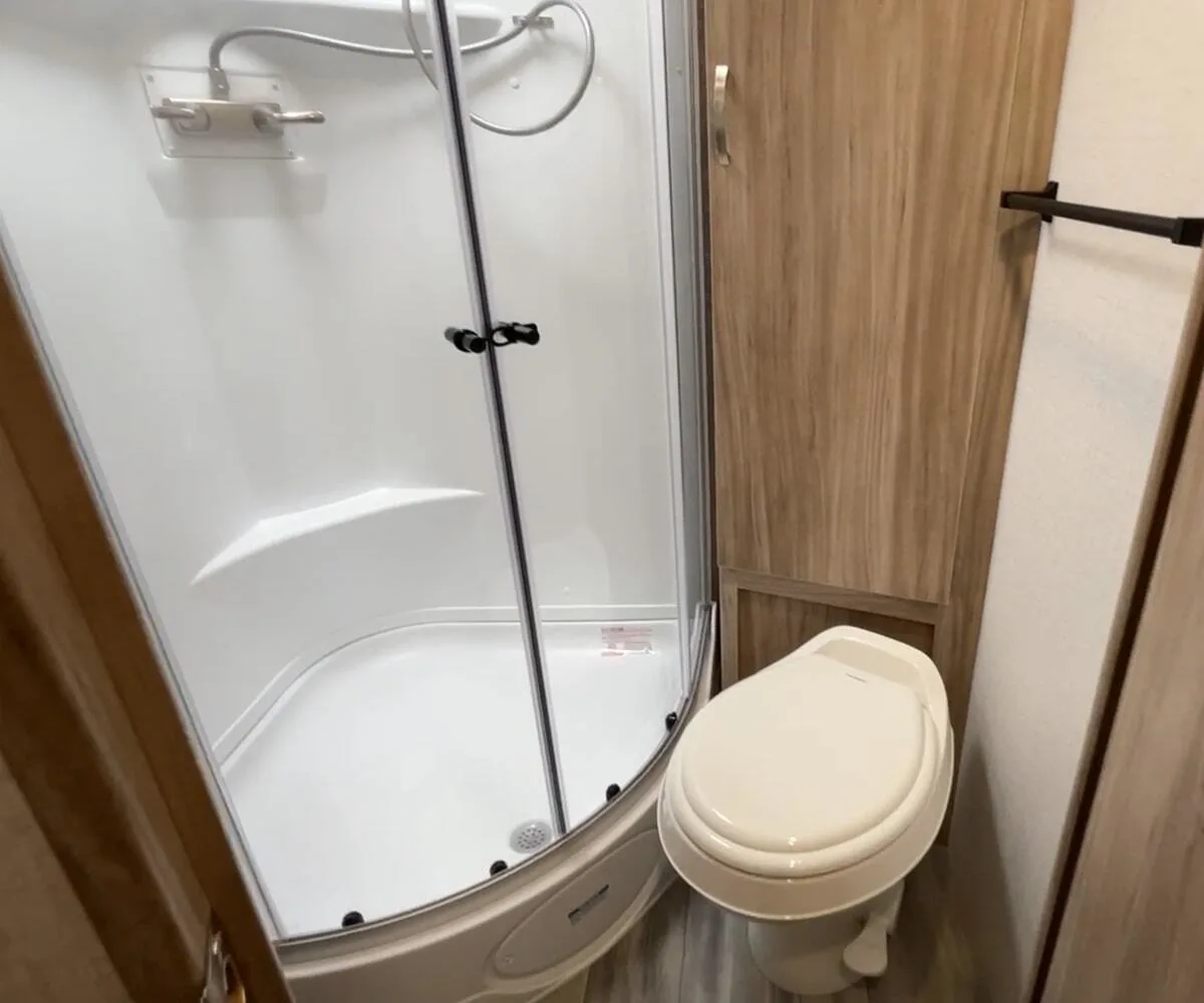 Bathroom with a toilet and a walk-in shower.