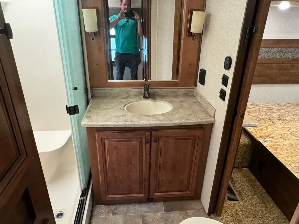 Bathroom with a sink and a walk-in shower.