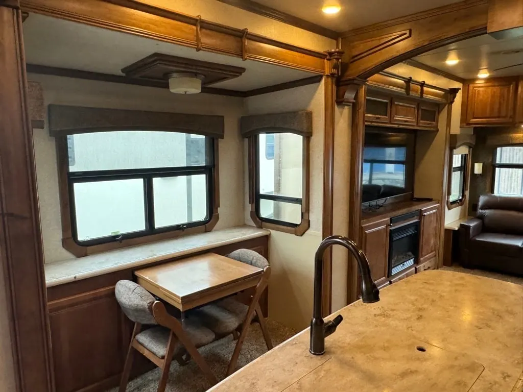 Dinette with a wood table and chairs.