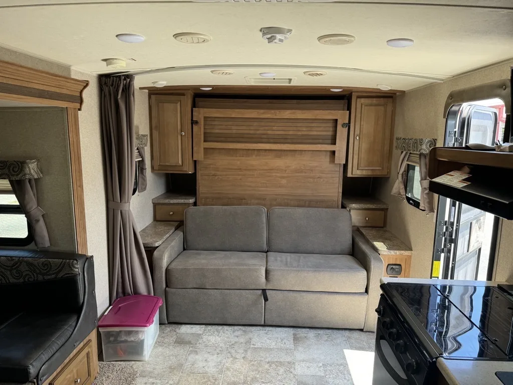 Living space with overhead cabinets. 