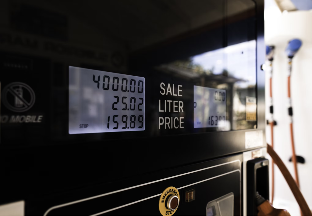 A close-up of a gas pump display showing the amount of fuel dispensed and the cost.