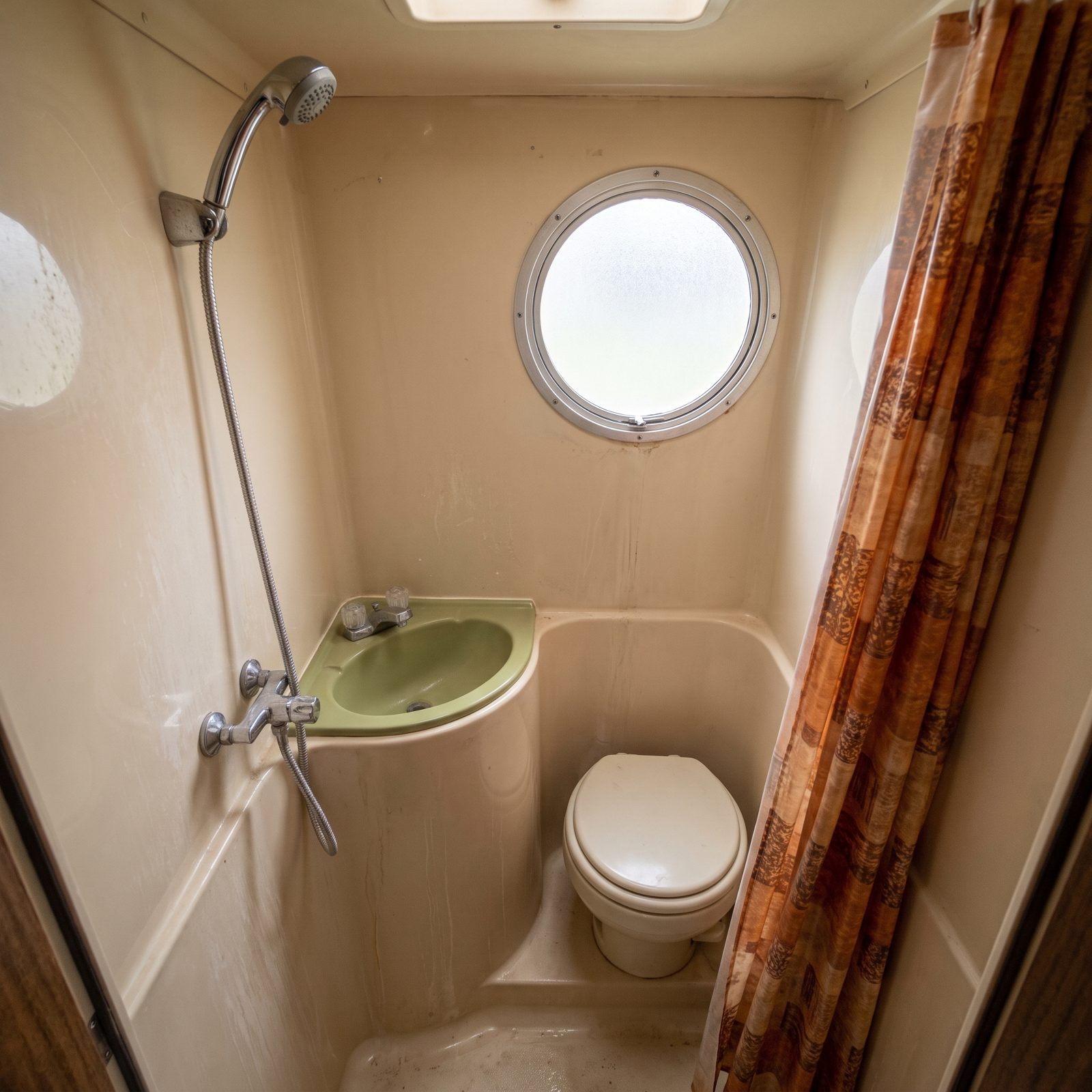 A Bathroom Sink Molded Into the Shower Compartment