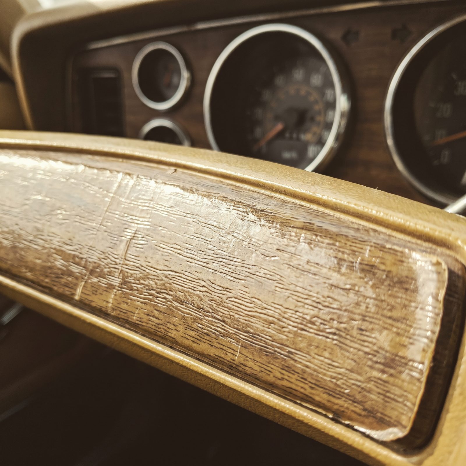 A Dashboard Covered in Woodgrain Plastic