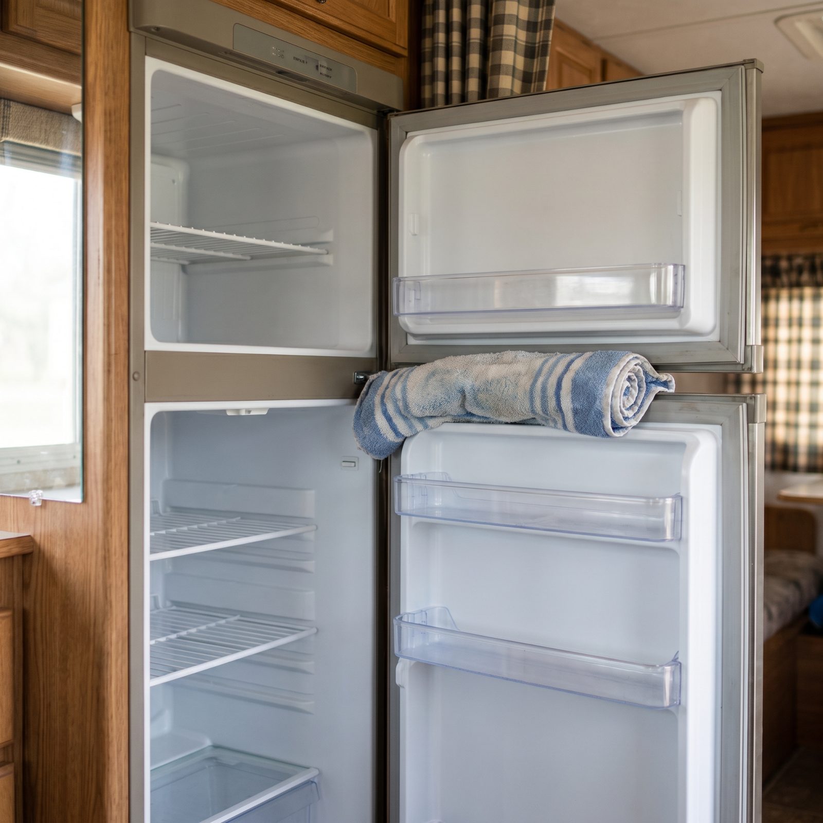 Empty and Clean the Refrigerator, Then Prop Its Doors Open