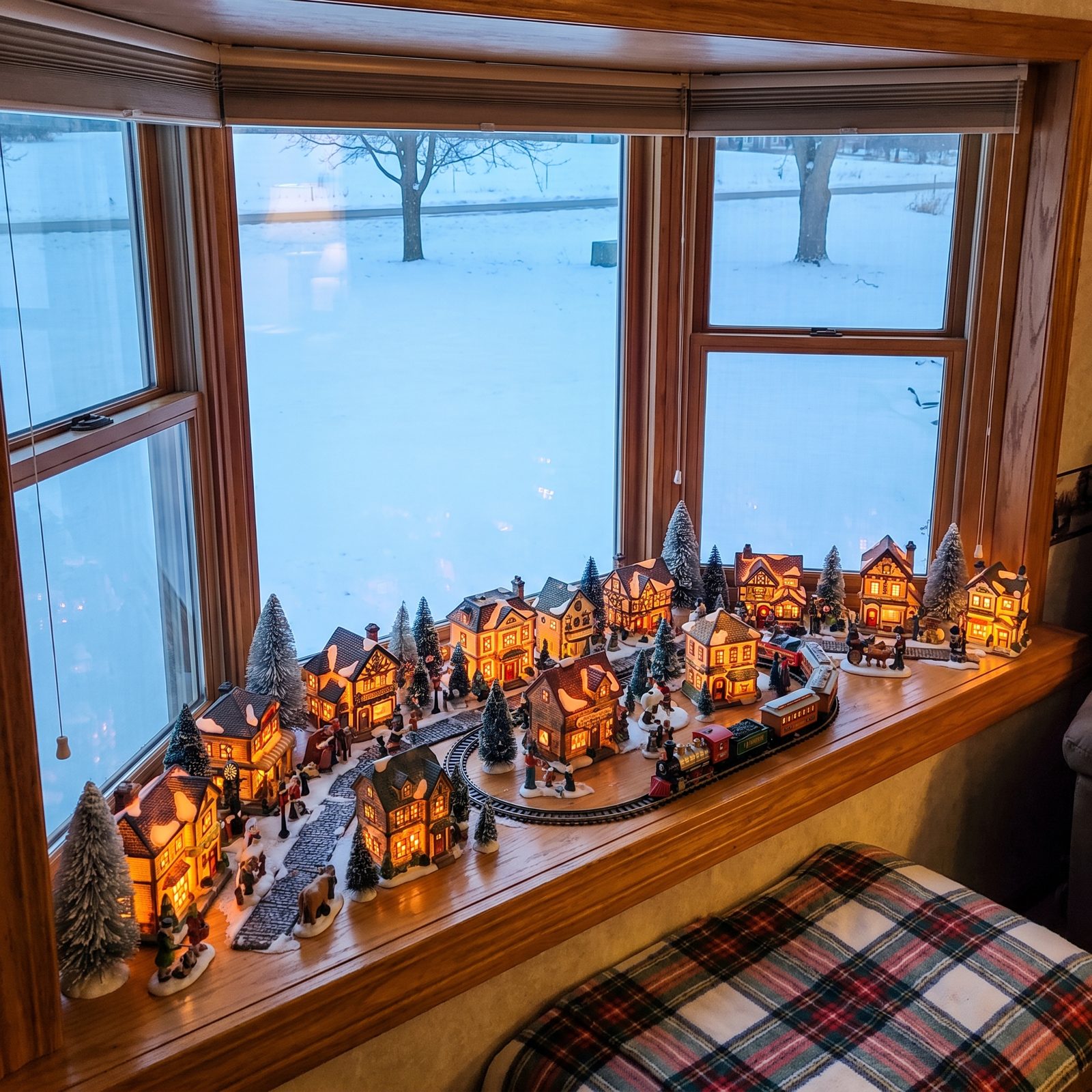 A Fifth Wheel With a Bay Window Turned Into a Christmas Village Display
