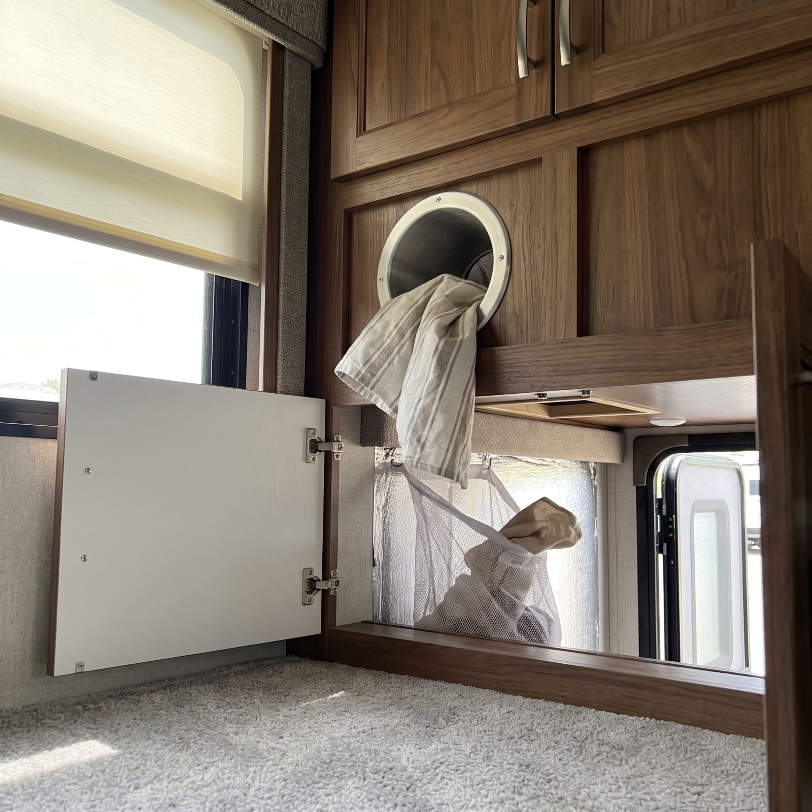A Laundry Chute Dropping Into an Exterior Storage Bay