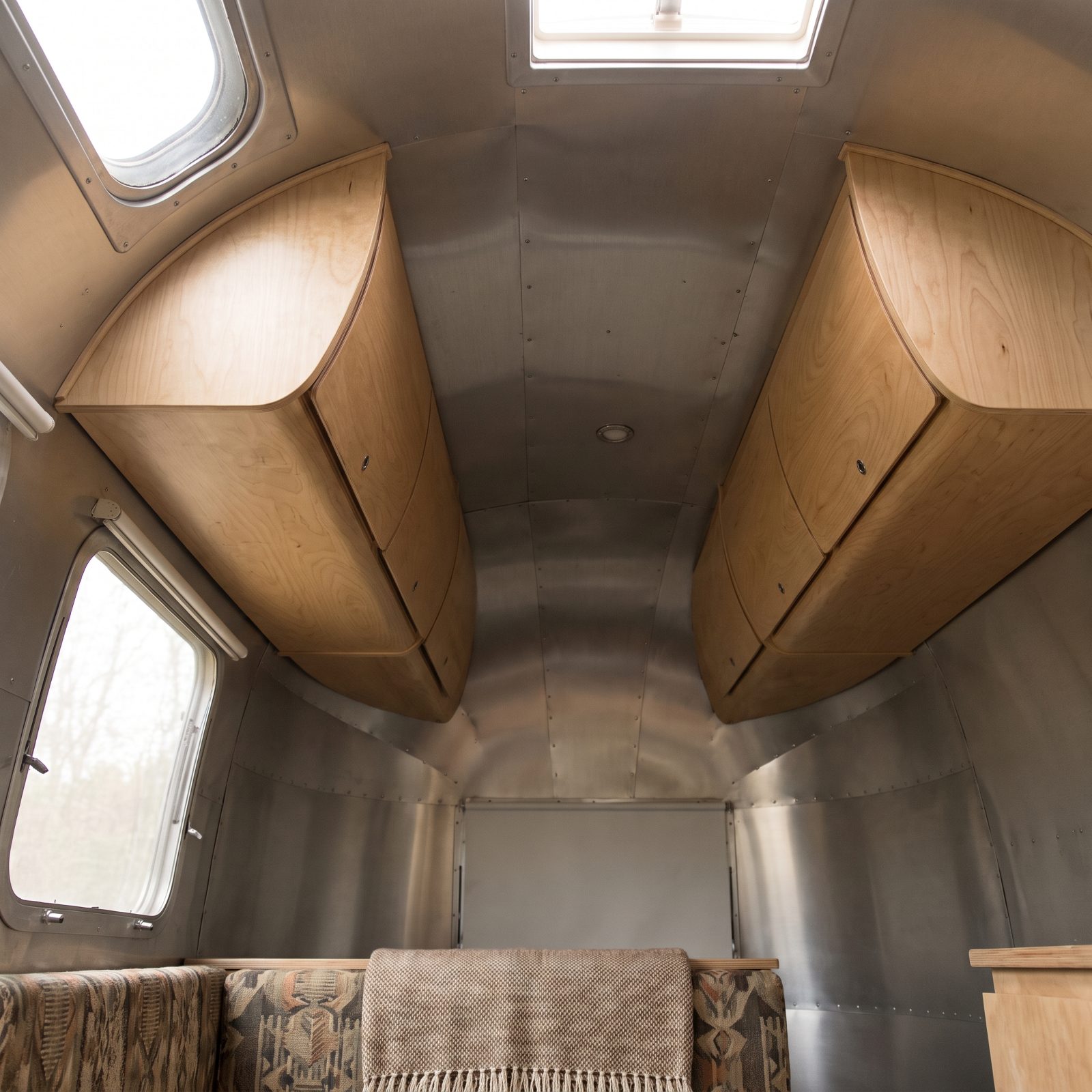 Overhead Lockers Shaped to Follow the Curved Roof