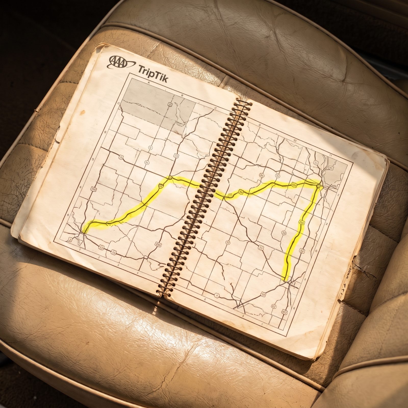 The Spiral-Bound AAA TripTik With the Route Marked in Highlighter